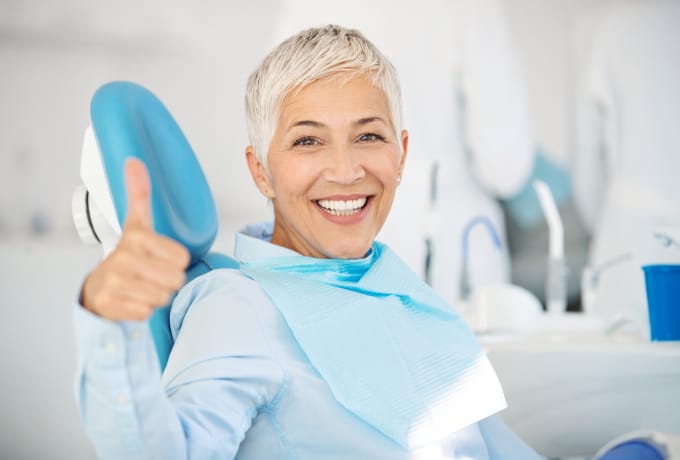 happy patient smiling in dental chair